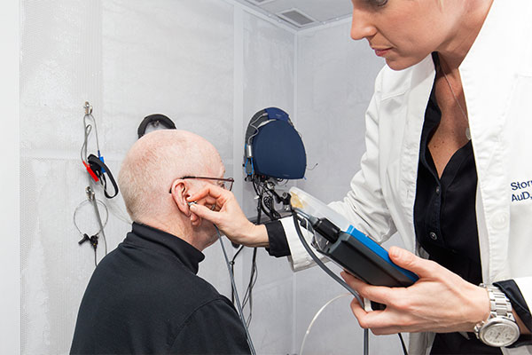 Patient with hearing loss taking a hearing test