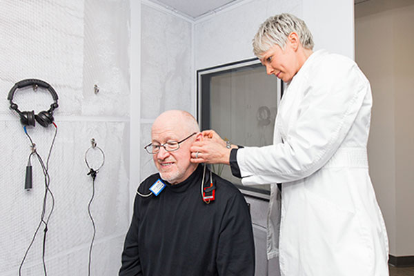 Patient getting a hearing test at Blue Sky Hearing